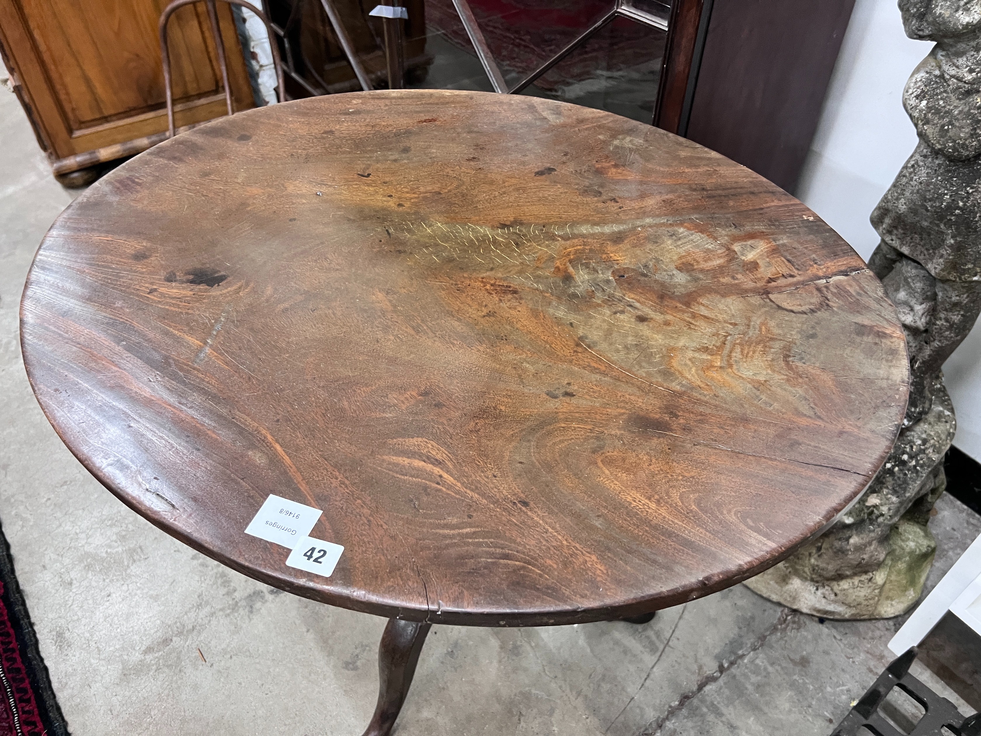A George III oval top tilt top tripod tea table, width 79cm, depth 65cm, height 71cm *Please note the sale commences at 9am.